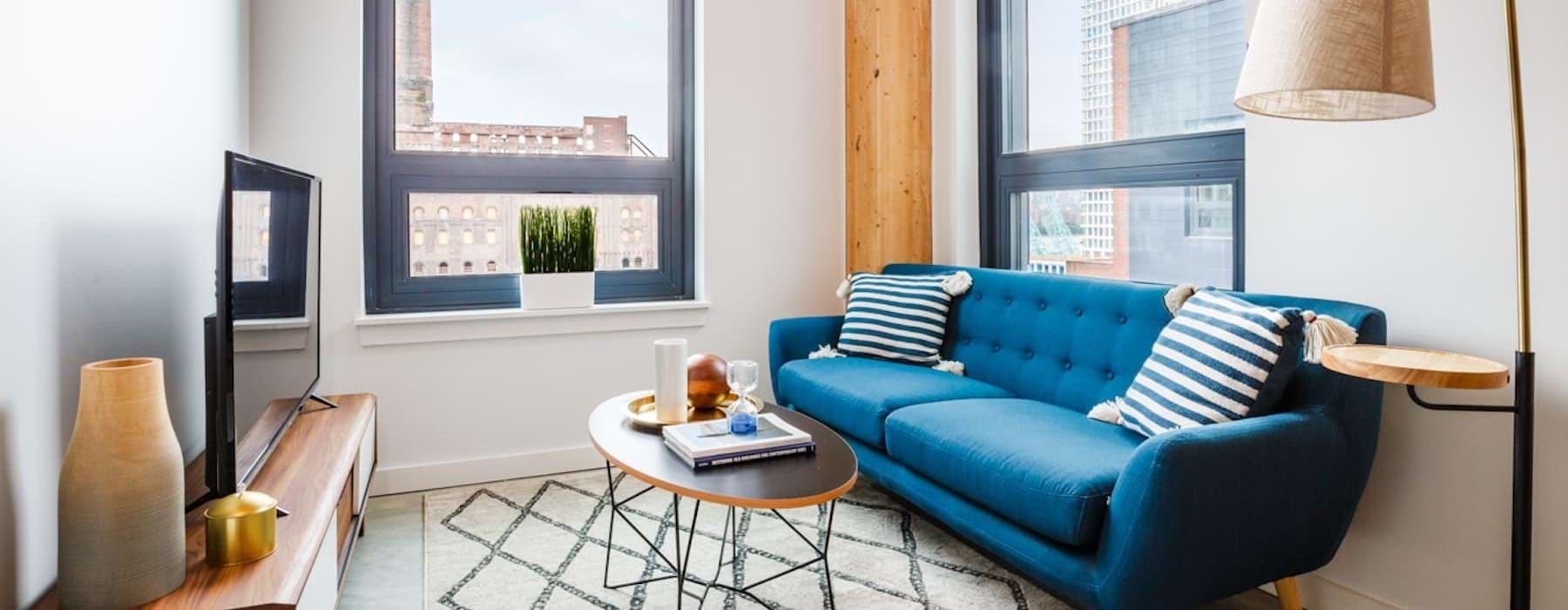 a living room with a blue couch