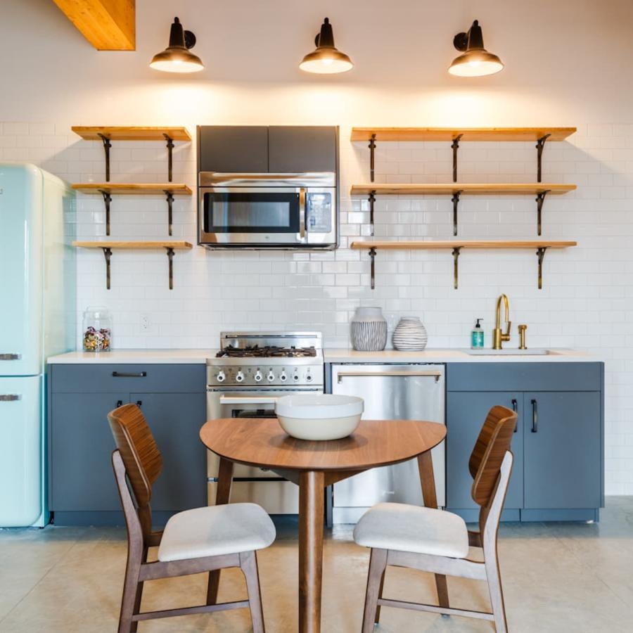 a kitchen with a table and chairs