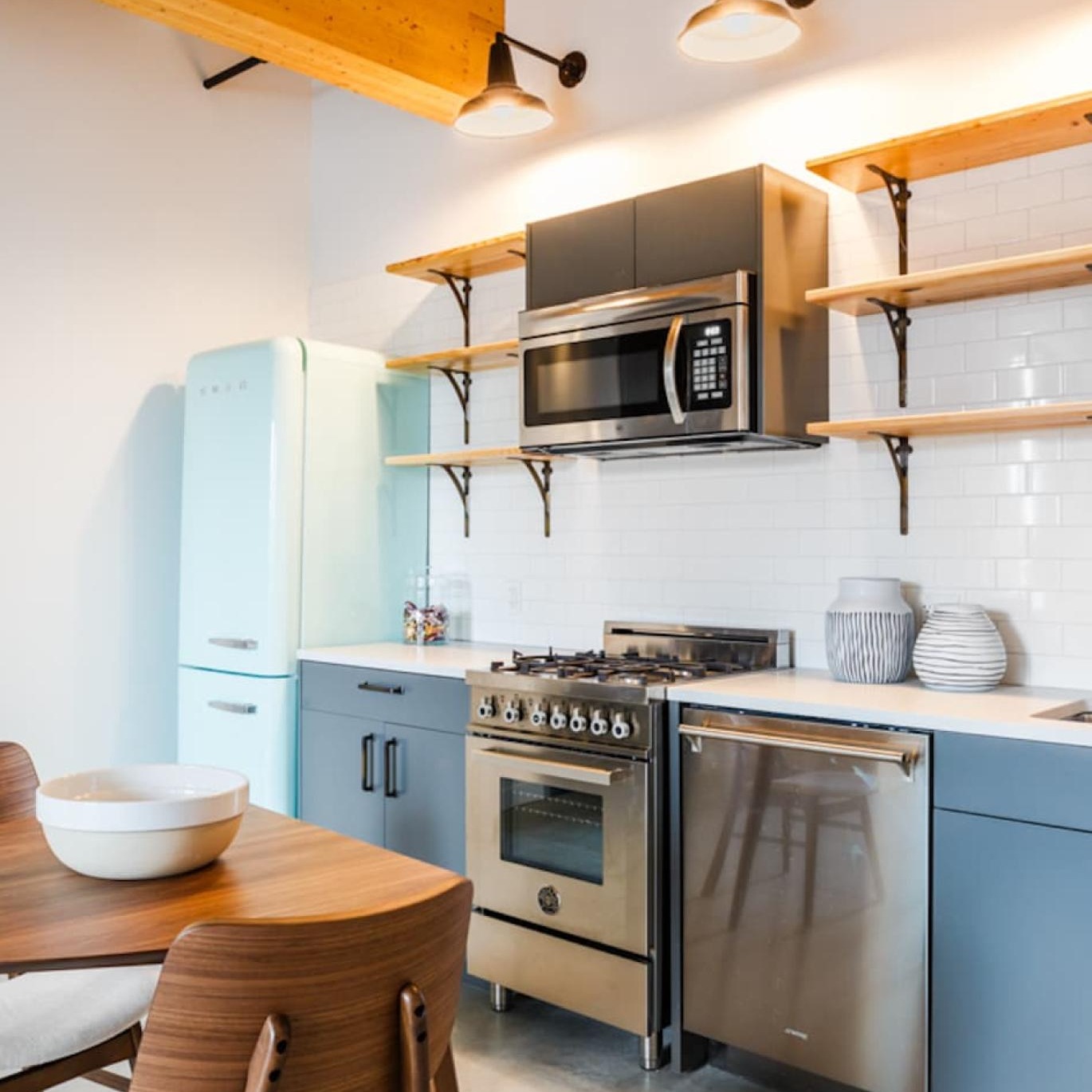 a kitchen with a table and chairs